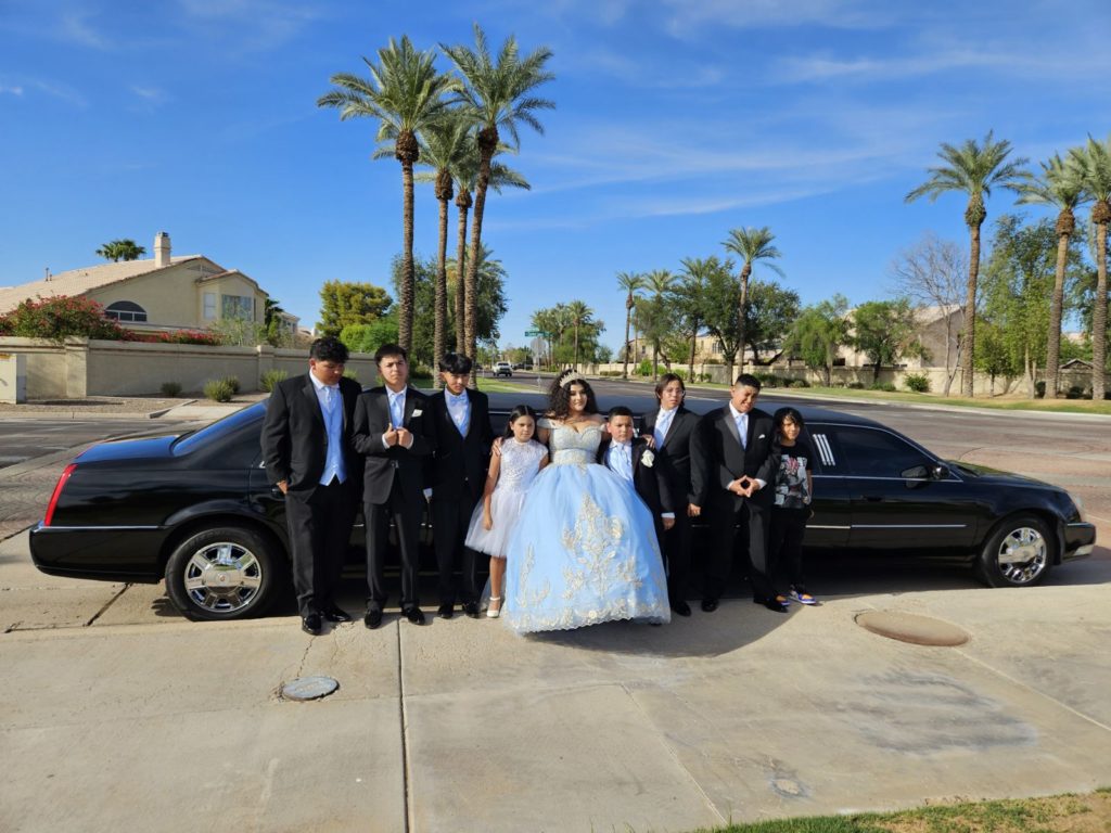 Family in Front of a Limousine